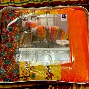 Reversible cotton quilt NWT/package! Never been opened or touched.